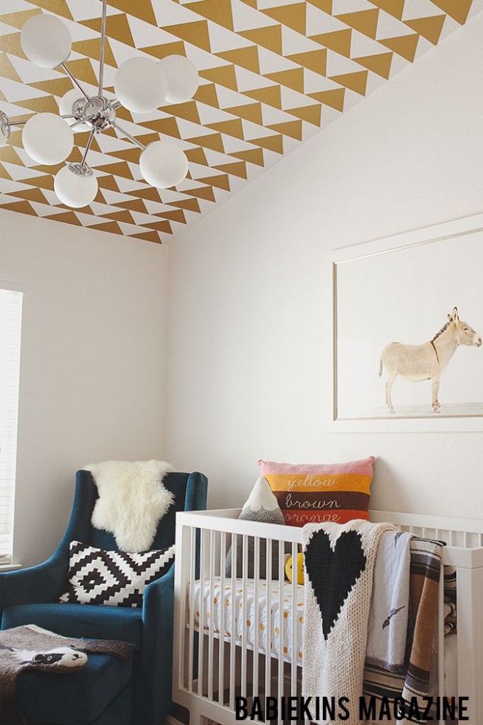 Tasteful Nursery With Gold Wallpapered Ceilng