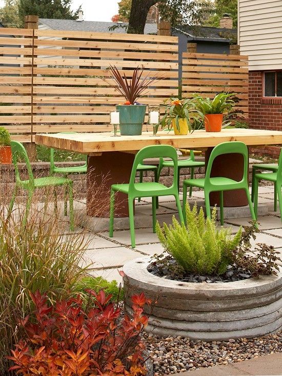 Comfortable Outdoor Dining Area with Pallet Inspired Privacy Fence