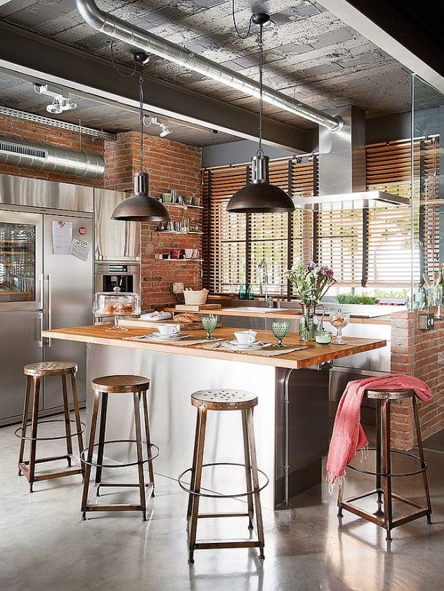 Modern Kitchen with Steel and Exposed Brick