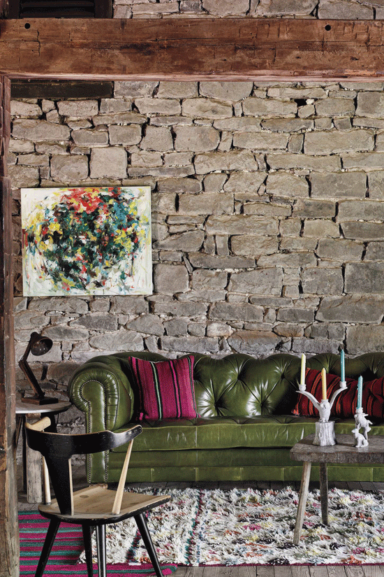 Tufted Leather Sofa with Bold Stone Wall